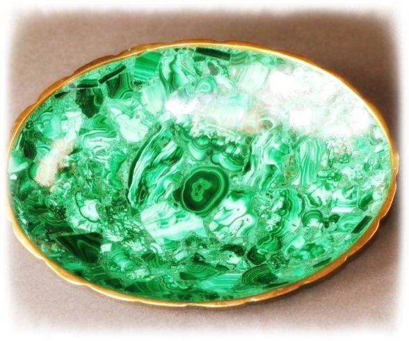 Looking down on a bowl sculpted from malachite crystal