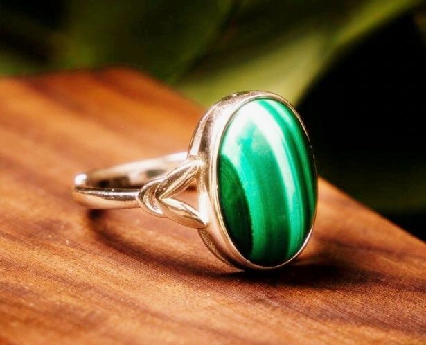 Simple malachite ring sitting on a table