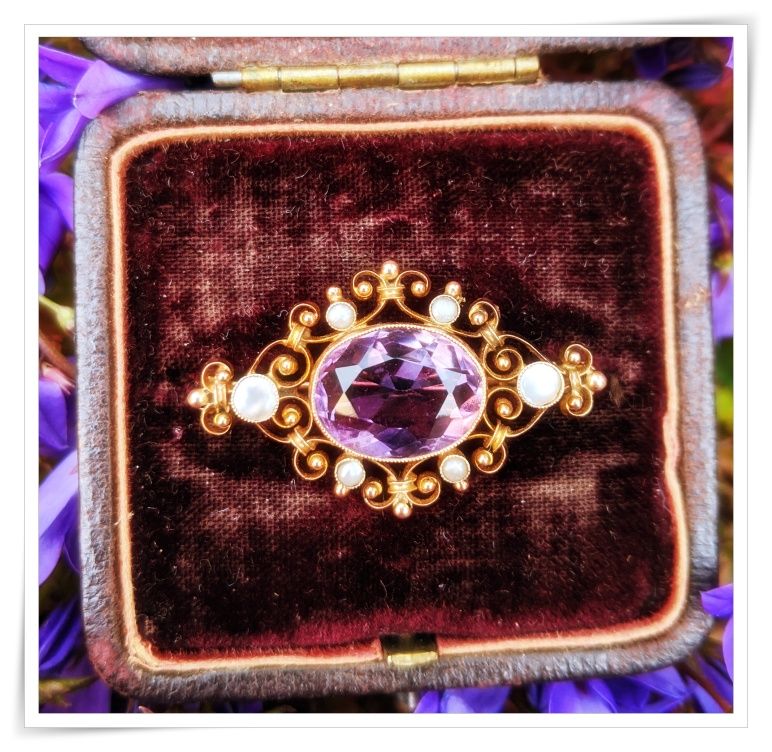I mage of and amethyst broach in a case.  Naan, Naan Design, Naandesign