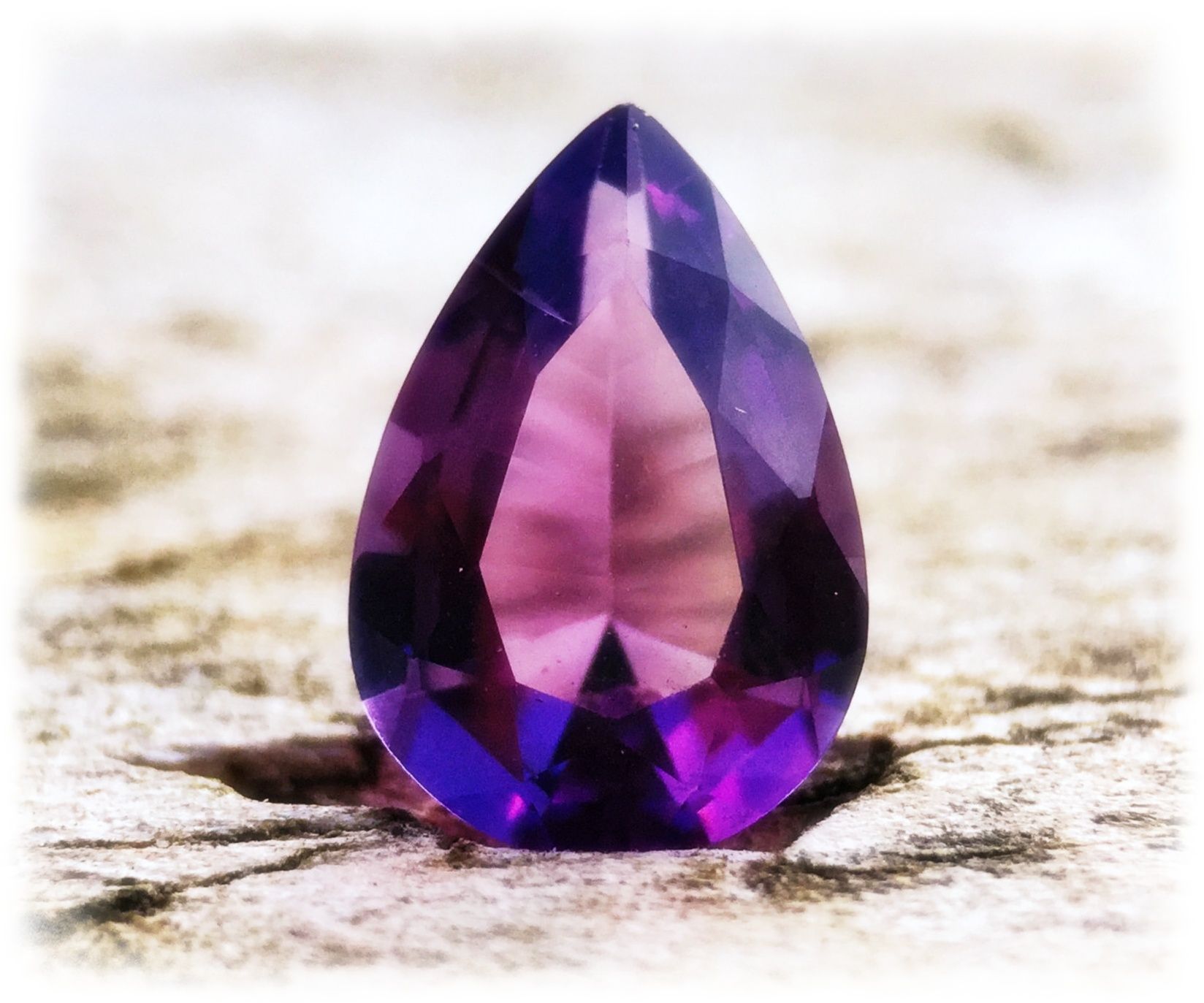 Close up image of an amethyst teardrop jewel